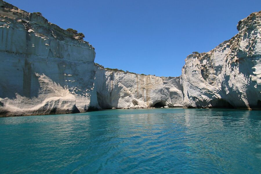 Kleftiko, Milos Island: azure sea framed by steep cliffs under a clear sky