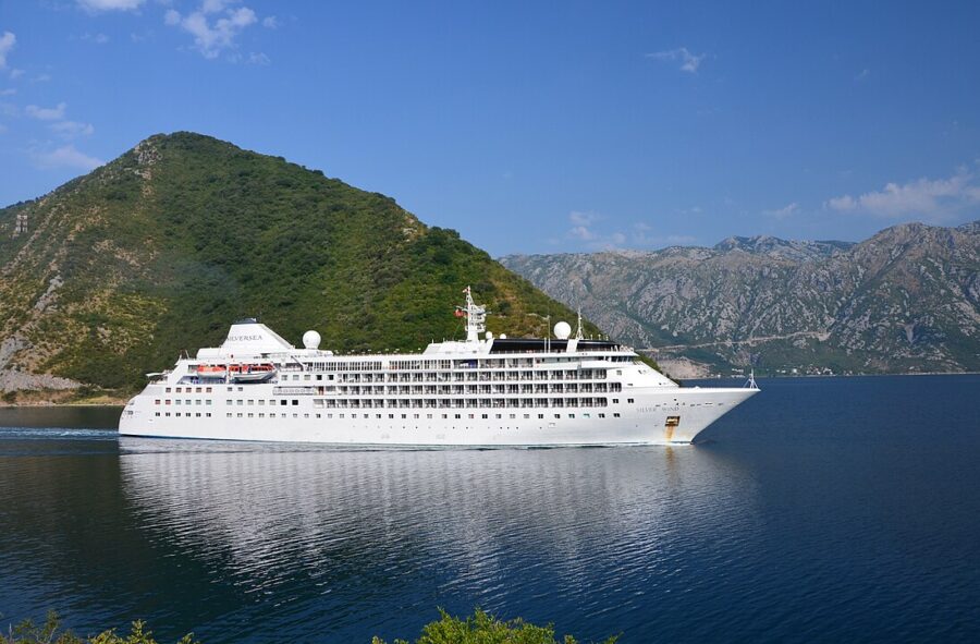 Cruise ship sailing on a serene lake, showcasing the beauty of Kotor Cruise.