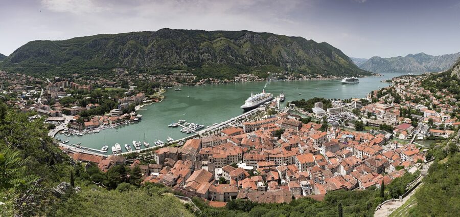 Scenic panorama of Kotor, Montenegro, highlighting the city's coastal charm and dramatic mountainous backdrop.