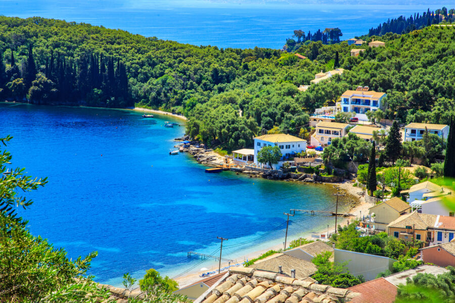Aerial view of boats docked in Kouloura port, showcasing the scenic beauty of Corfu, Greece
