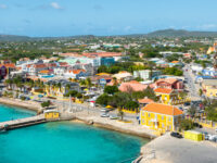 Kralendijk, the vibrant capital and harbor of Bonaire Island in the Caribbean Netherlands, showcasing colorful buildings and boats.