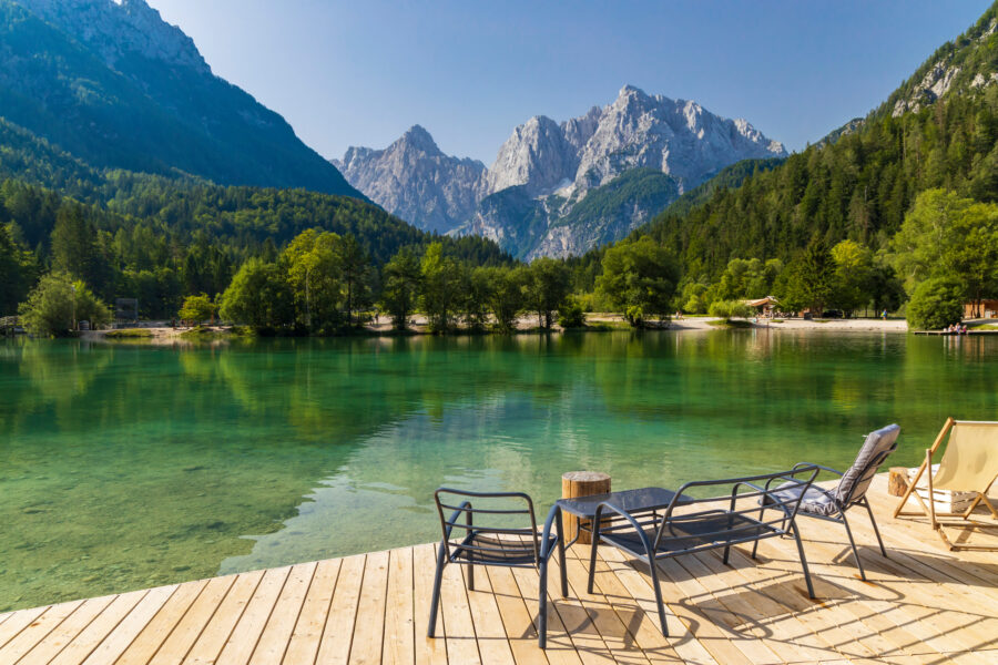 Scenic view of a tranquil lake surrounded by mountains near Kranjska Gora village in Triglav National Park, Slovenia