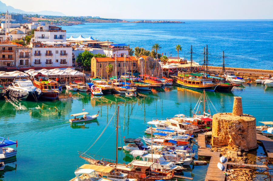 Scenic panorama of Kyrenia's old harbour, featuring the Mediterranean coastline and historic architecture of Cyprus.