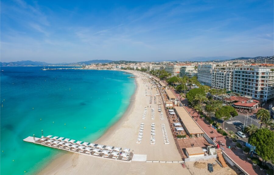 Panoramic view of La Croisette in Cannes, showcasing the Mediterranean beach and luxury resort atmosphere of the French Riviera
