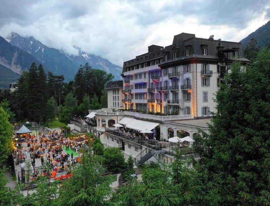 La Folie Douce Hotels Chamonix, nestled among majestic mountains and lush trees, offers a stunning natural backdrop.
