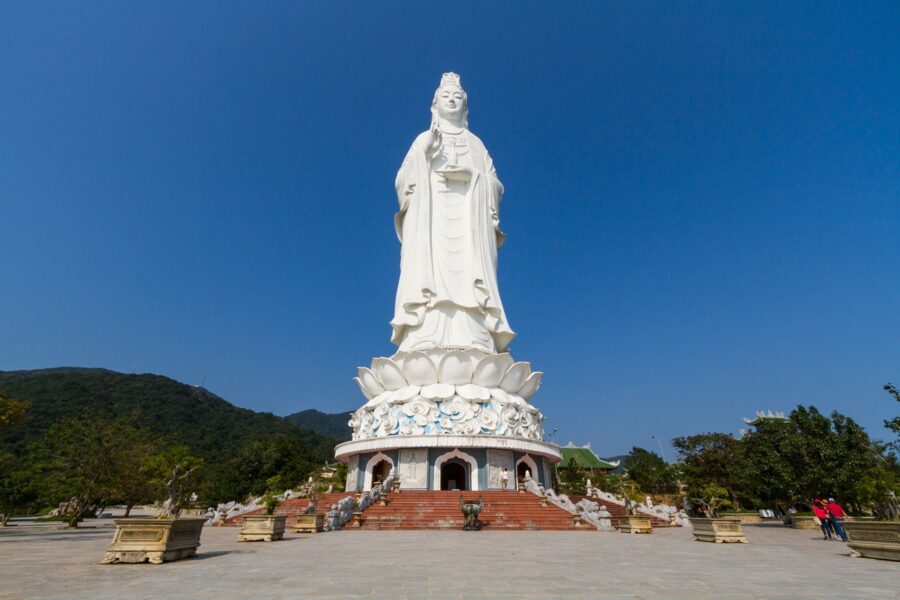 Lady Buddha statue at Linh Ung Pagoda in Da Nang, Vietnam, with blue sky backdrop.