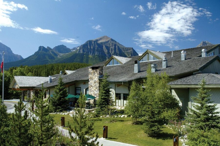The lodge at Banff National Park, featuring the scenic Lake Louise Inn in Canada, surrounded by stunning mountain views.