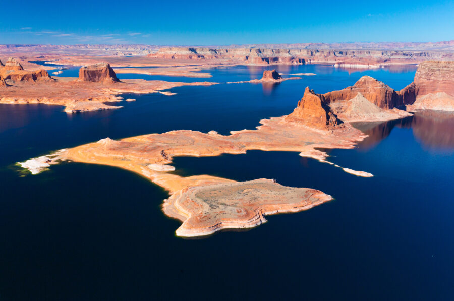 Scenic view of Lake Powell in Page, Arizona, showcasing its blue waters and surrounding red rock formations.