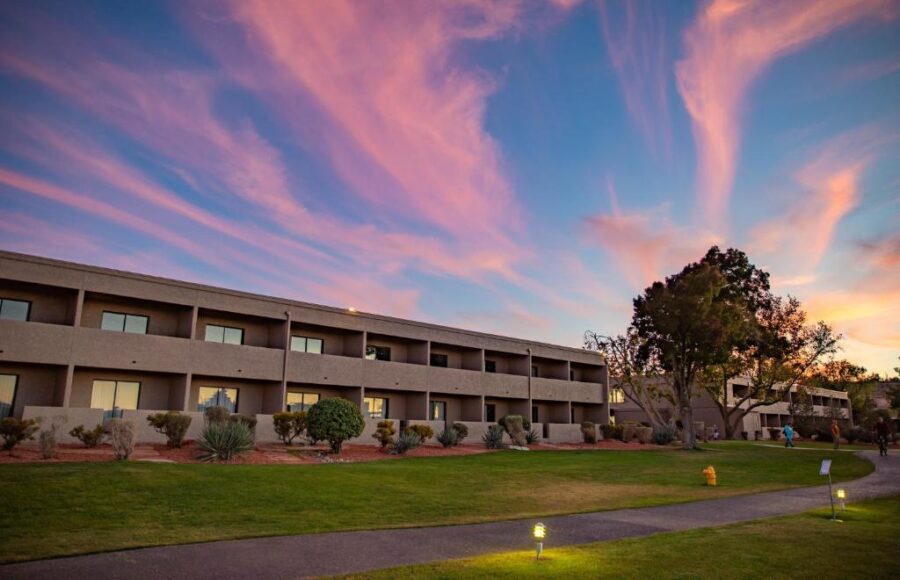 The exterior of Lake Powell Resort in Arizona illuminated by a stunning sunset.
