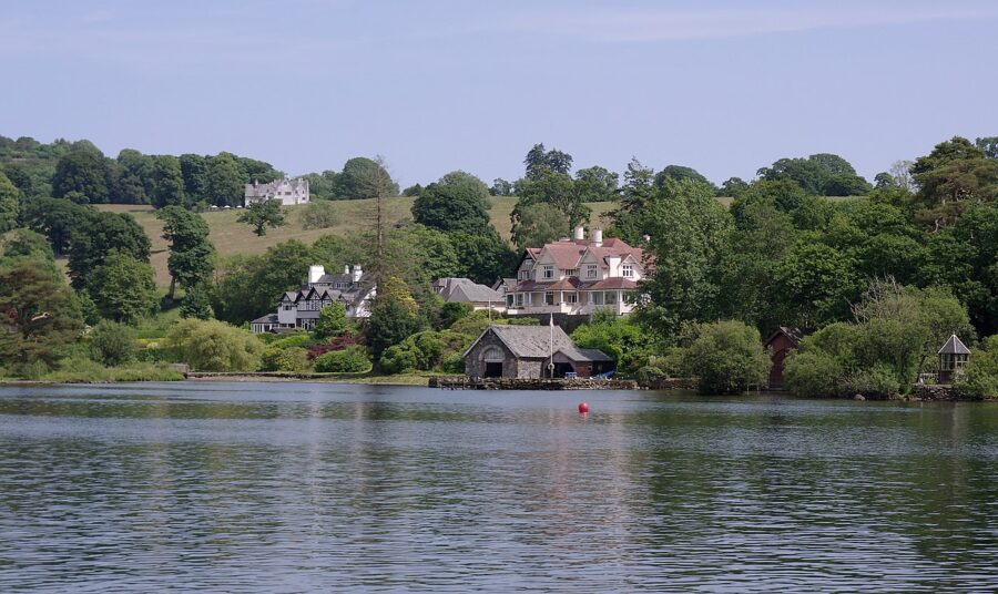 Picturesque scene of Lake Windermere, England, showcasing a house situated on the peaceful lakeshore.