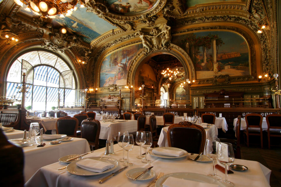 Elegant interior of Le Train Bleu restaurant in Paris, showcasing luxurious decor and exquisite design elements