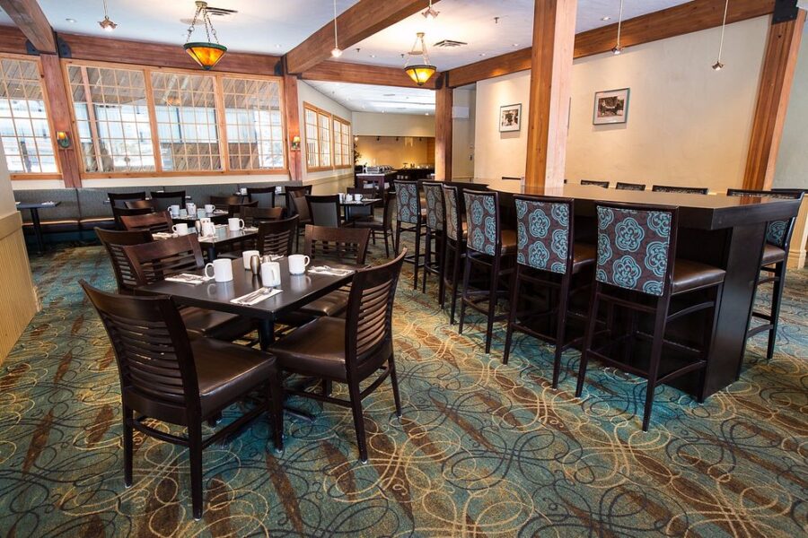 Dining room at Legends Restaurant, Lake Louise, Canada, featuring modern decor and seating for guests.