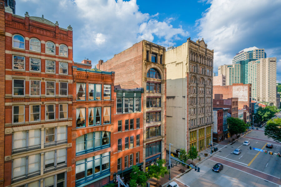 Downtown Pittsburgh's Liberty Avenue features a row of buildings, highlighting the city's architectural diversity and urban life