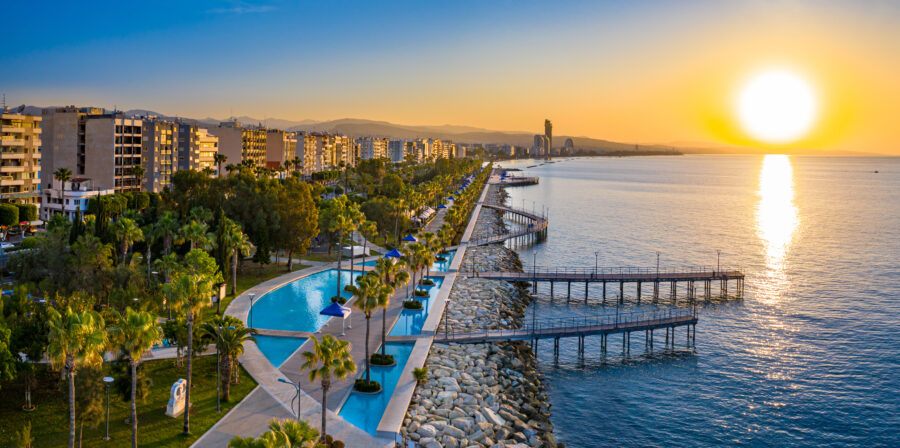 Sunrise over the Mediterranean Sea at Limassol, Cyprus, showcasing a scenic walking area with a beautiful sea view