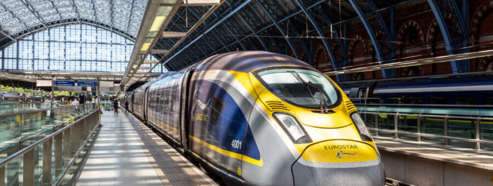 The modern Eurostar bullet train stands at a London platform, showcasing its streamlined design.
