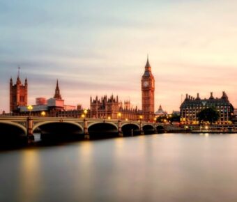 Sunset over Thames, Big Ben, Westminster Bridge, capturing iconic London skyline.