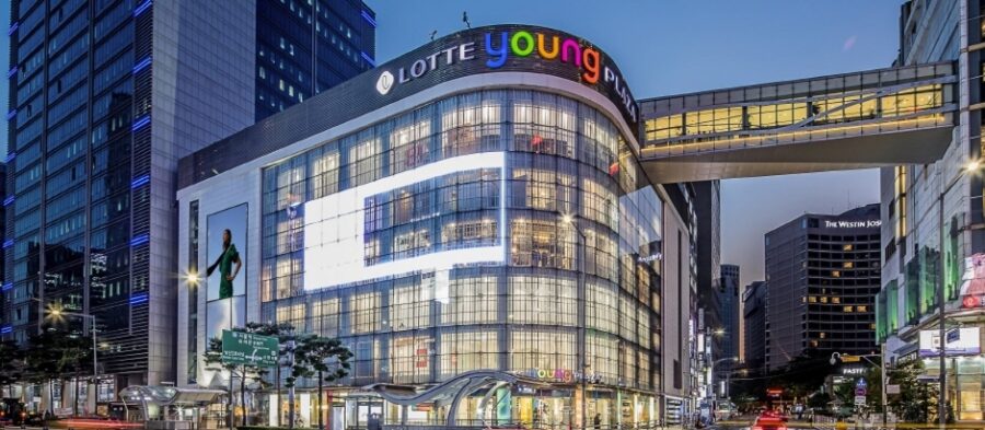 Lotte Young Plaza: modern shopping center with vibrant signage and urban evening backdrop.