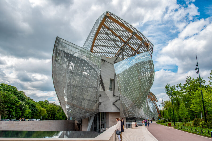 Modern Louis Vuitton Foundation building in Paris, featuring striking glass sails and contemporary architectural design.