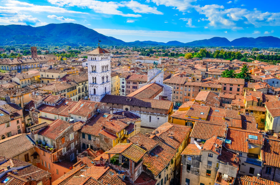 Panoramic view of Lucca, Italy, featuring charming buildings and vibrant landscapes surrounded by ancient city walls