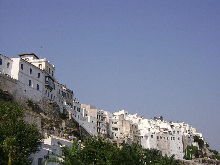 Panoramic view of Mahon, Menorca, featuring a prominent large white building.