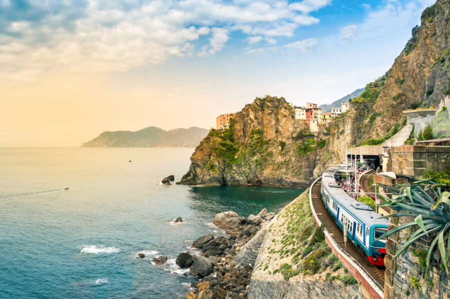 Scenic train station in Manarola, Cinque Terre, featuring colorful houses on a cliff by the sea