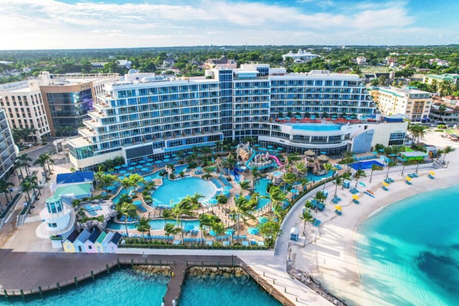 Margaritaville Beach Resort in Nassau, Bahamas, situated on a sandy beach surrounded by the turquoise ocean.