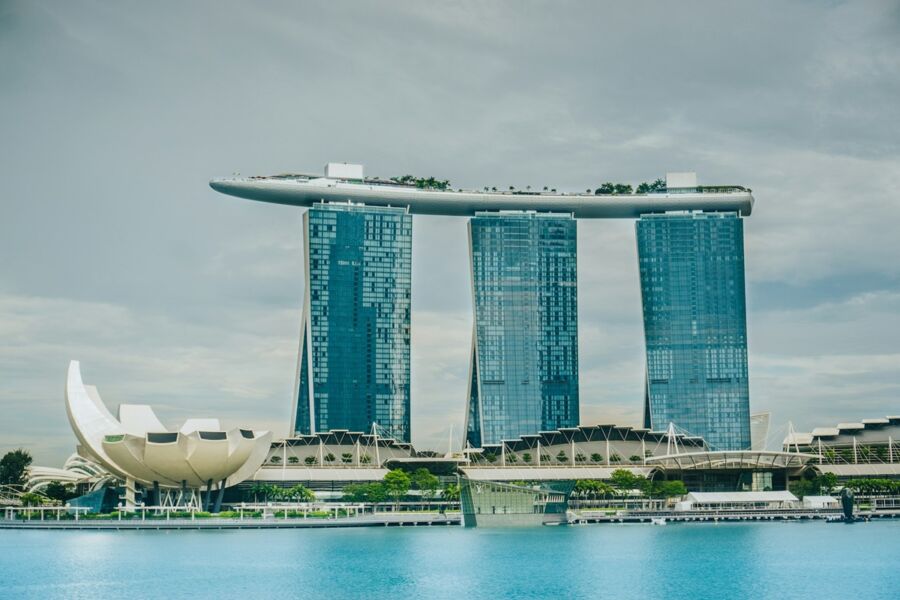 Marina Bay Sands, Singapore skyline featuring ArtScience Museum and lush greenery.