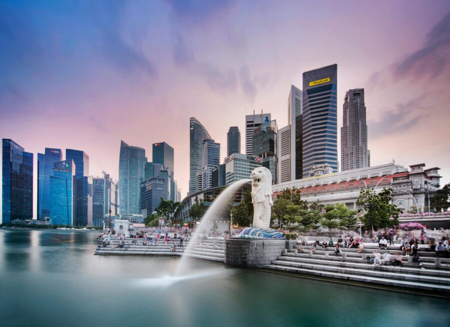 Merlion at Marina Bay, Singapores skyline, evening sky, vibrant promenade, iconic cityscape.