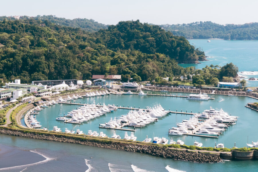 Scenic view of Marina Pez Vela in Quepos, Puntarenas, Costa Rica, featuring boats and lush coastal landscape