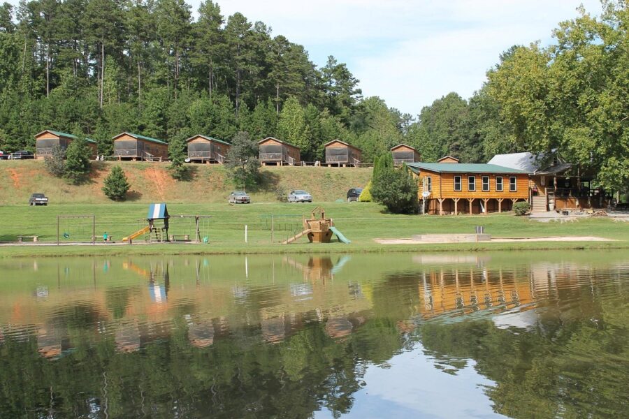 Serene lake in Marion, North Carolina, featuring a small cabin situated in the center of the water.