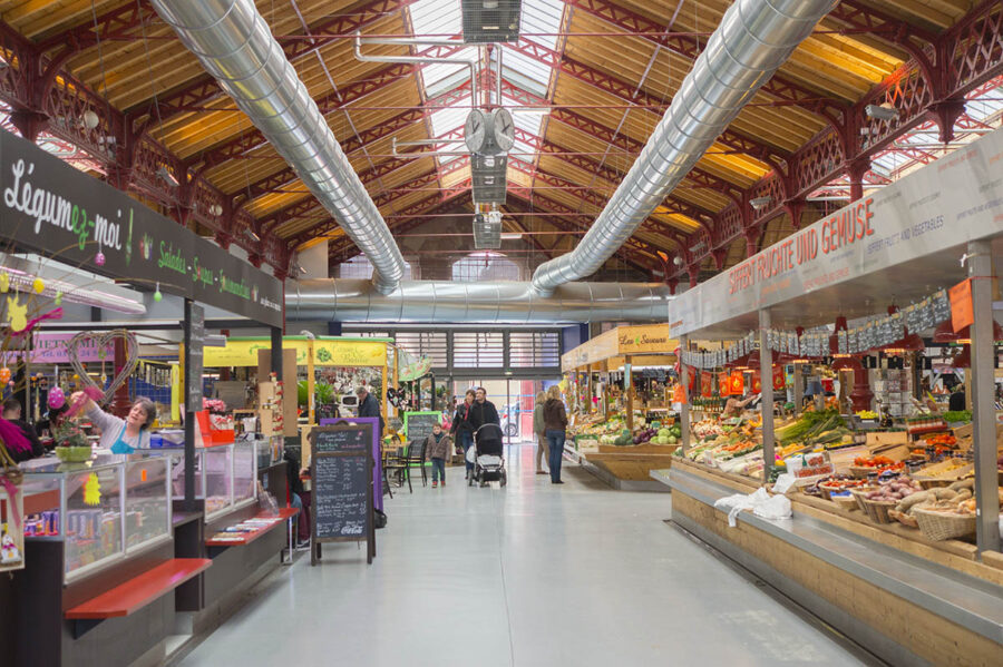 Colmar covered market hall with fresh produce stalls and artisan food vendors.