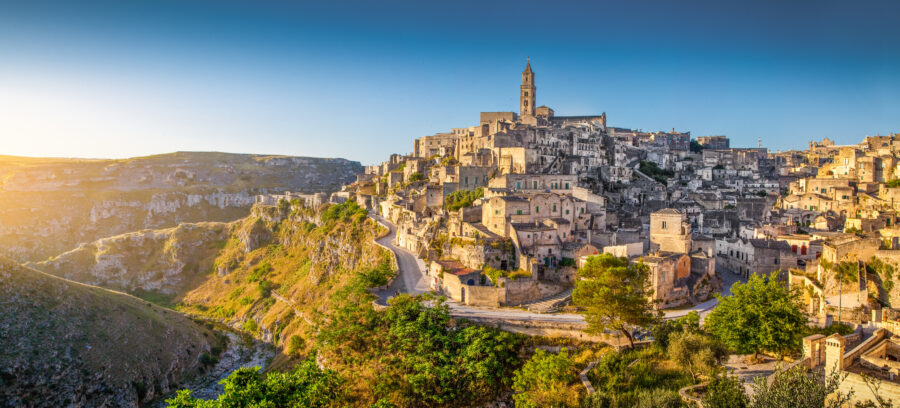 Panoramic view of Matera's ancient town, showcasing its historic cave dwellings and stone architecture in Basilicata, Italy.