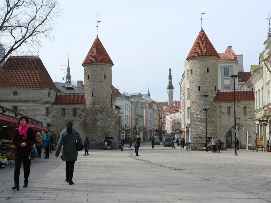 Viru Gate medieval stone towers on Tallinn Old Town pedestrian street.