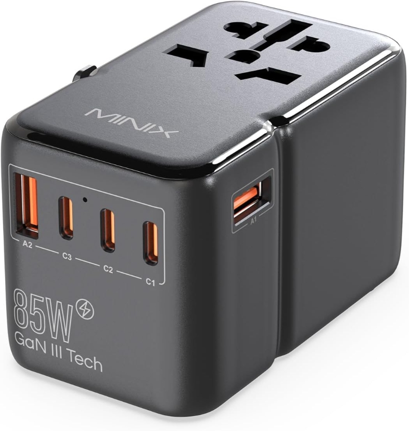 Mini USB travel adapter with three USB ports, labeled as MINIX Travel Laptop Charger, ideal for charging devices on the go.

