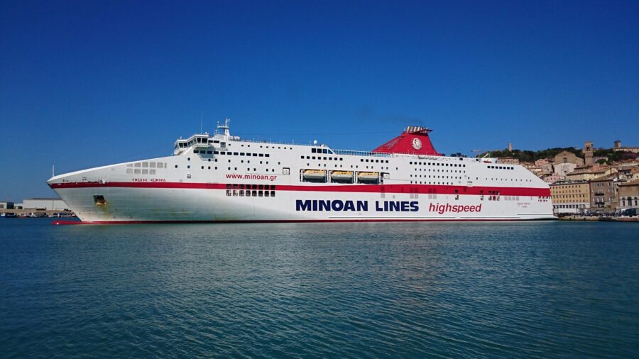 High-speed Minoan Lines ferry Europa in harbor, blending modern design with serene maritime backdrop.