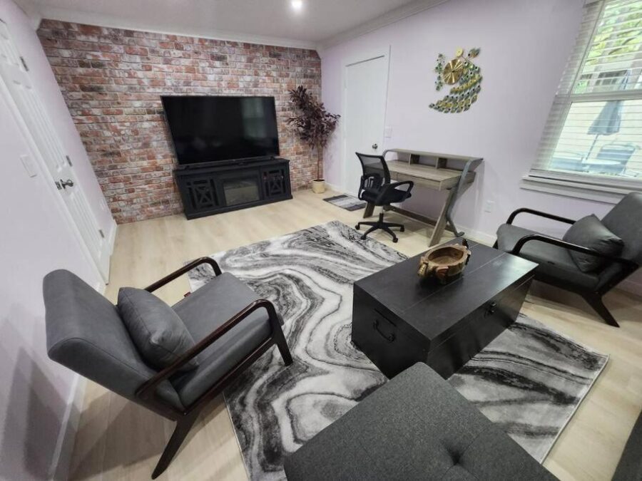 Cozy living room featuring a couch, chair, and TV in a pet-friendly villa on Hilton Head Island, South Carolina.
