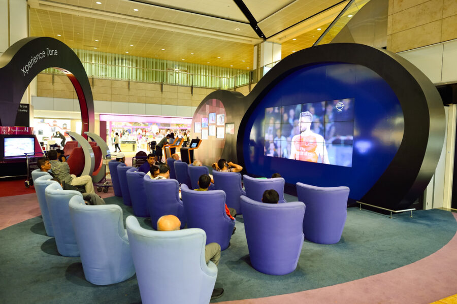 Modern lounge for relaxation and entertainment in a vibrant shopping center zone.