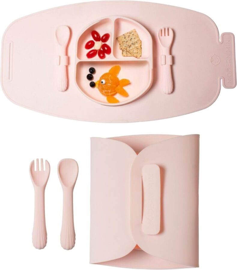Pink lunch box containing a fork, spoon, and knife, labeled as a Modern Mini Travel Plate Set.