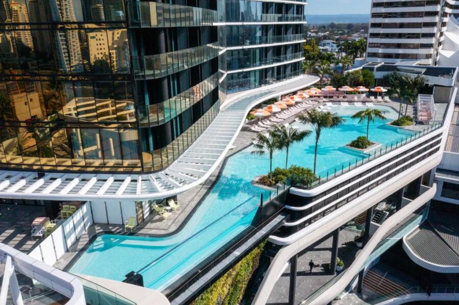 Luxurious modern rooftop pool complex at Dorsett Gold Coast hotel with city skyline views.