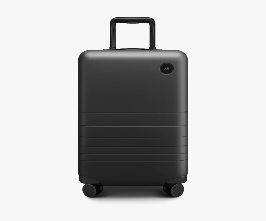 Monos Carry-On suitcase in black, featuring wheels, set against a white background.