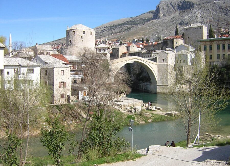 The iconic Stari Most bridge over a river in Mostar, Bosnia and Herzegovina, showcasing the city's rich cultural heritage.

