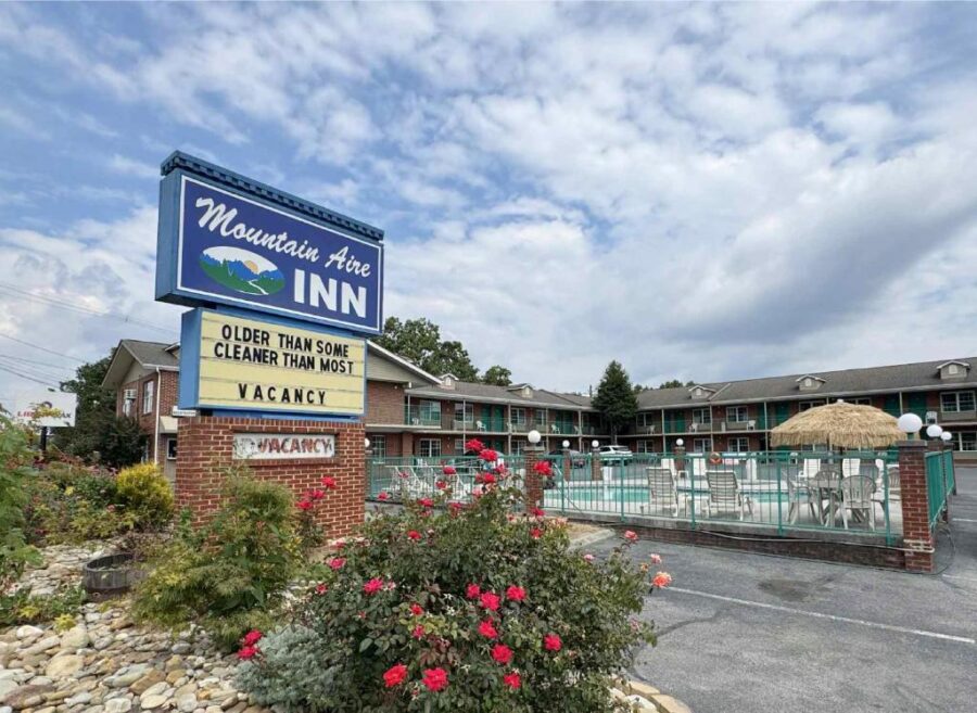 Front entrance of Mountain Aire Inn, a cozy motel in Sevierville, near Pigeon Forge, surrounded by scenic mountains.