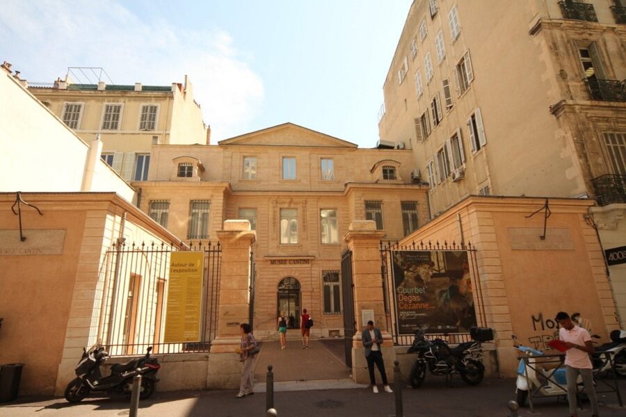 Exterior view of Musée Cantini, showcasing blend of classical architecture and urban culture.