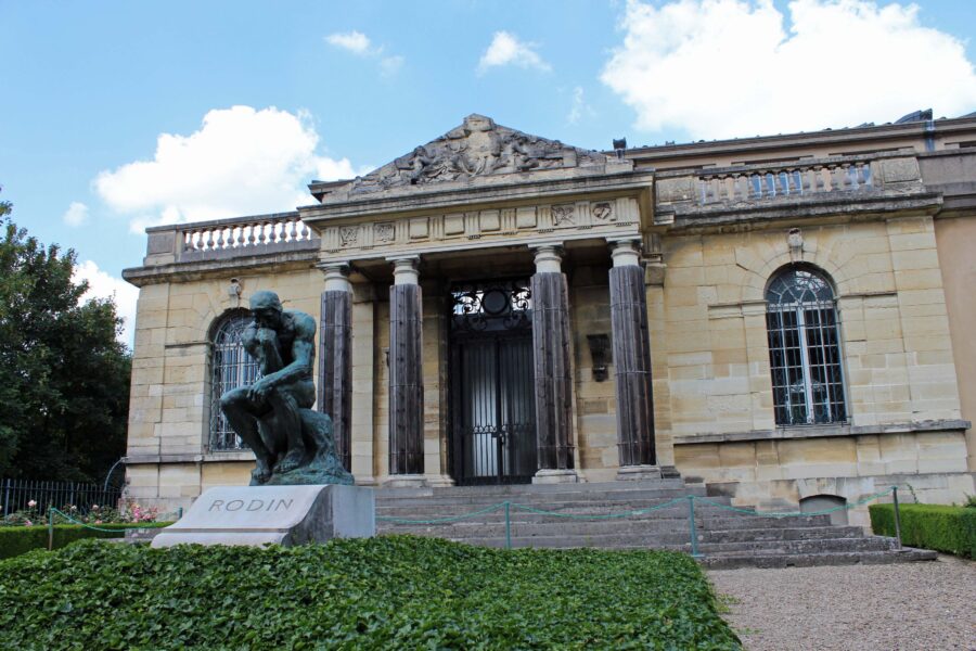 Exterior view of Musée Rodin in Paris, showcasing its beautiful architecture and surrounding gardens.