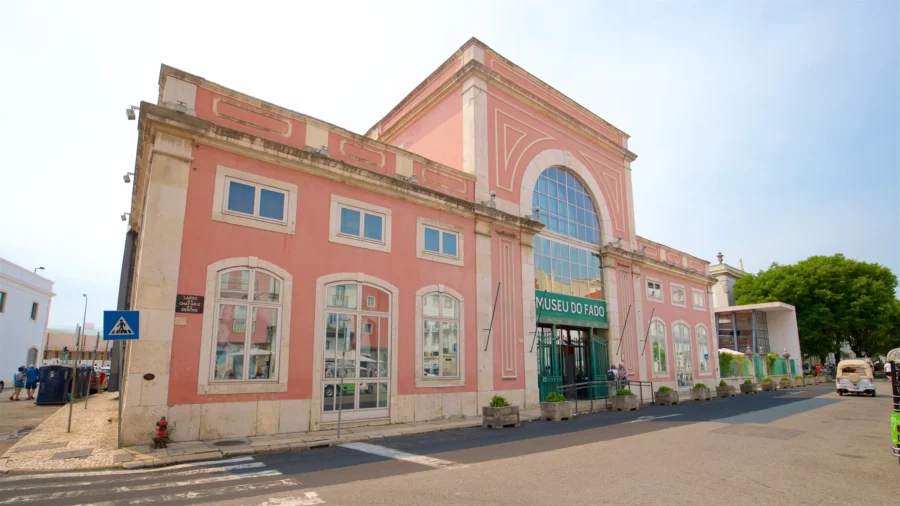 Museu do Fado Lisbon pink museum facade on sunlit street.