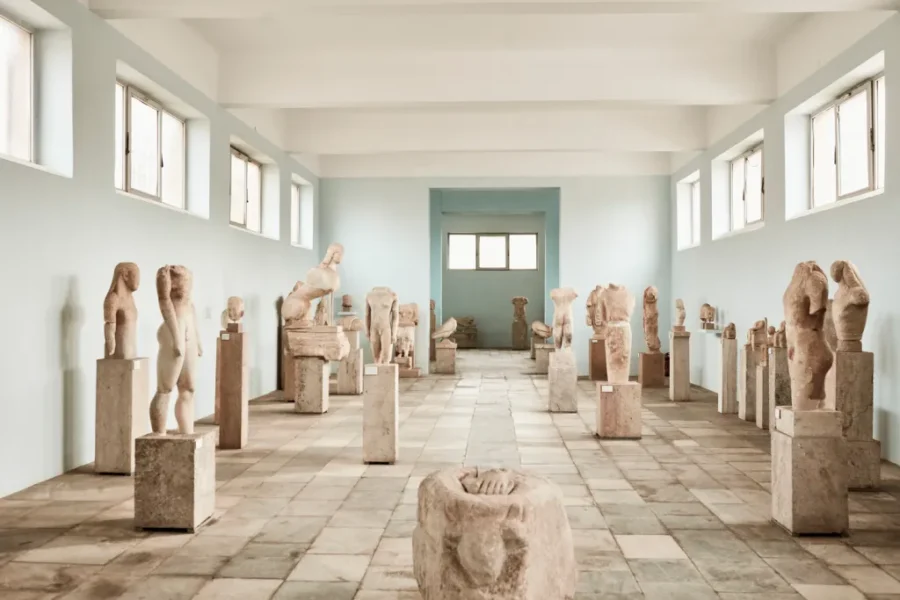 Minimalist stone sculpture gallery with natural lighting and serene ambiance.