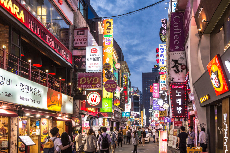 People wander in the walking street of the Myeong-dong shopping and entertainment district at night Myeongdong Seoul, South Korea