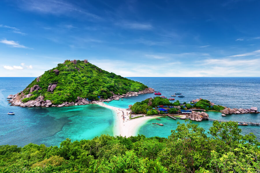 Stunning beach landscape of Nang Yuan Island in Koh Samui, Thailand, with vibrant blue sea and inviting white sand