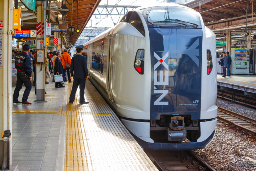 Narita Express train at Ikebukuro Station platform in Tokyo, bound for Narita Airport.