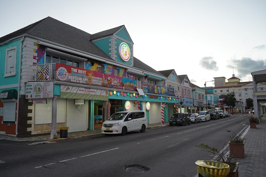 Colorful building located on Nassau Bay Street, adorned with a visible sign that enhances its lively appearance.
